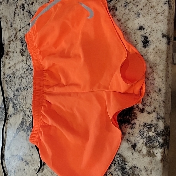 Nike Pants - Nike bright orange size M Dri-Fit running shorts. Worn twice!